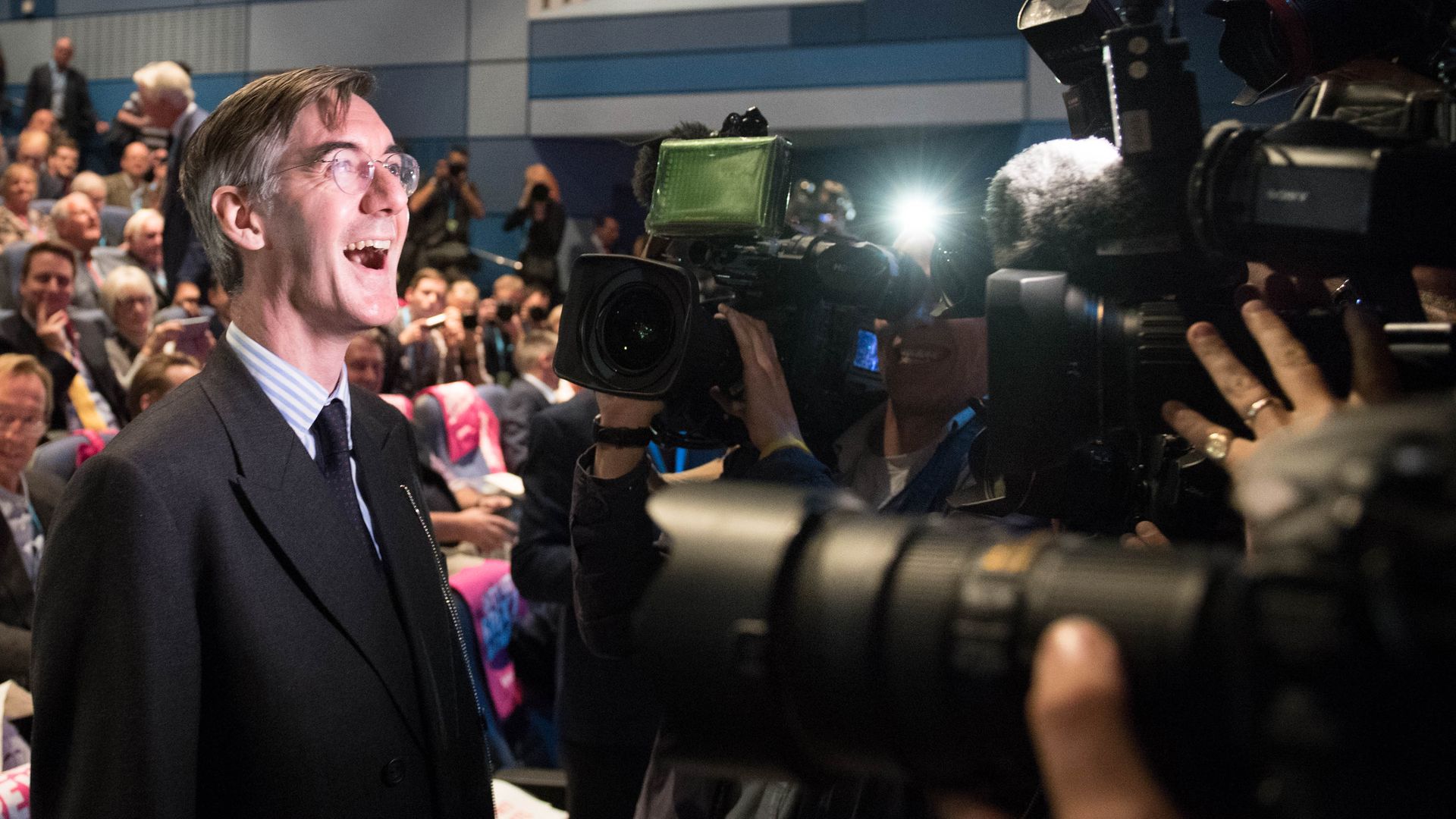 Jacob Rees Mogg smiles for the camera during a fringe event to discuss Brexit during the Conservative Party annual conference in Birmingham - Credit: Stefan Rousseau/PA Wire/PA Images