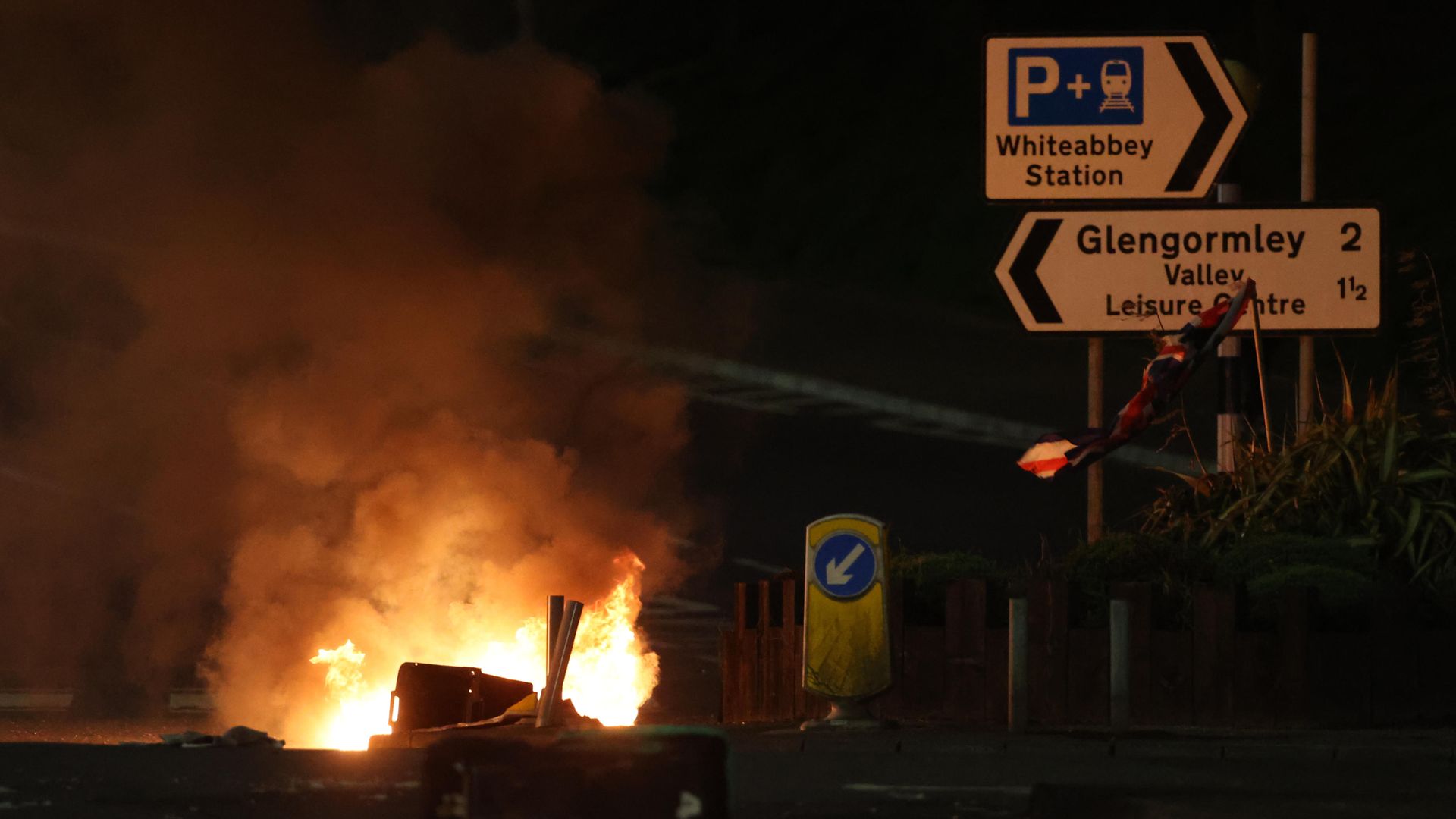 Bins are set ablaze at the Cloughfern roundabout in Newtownabbey - Credit: PA