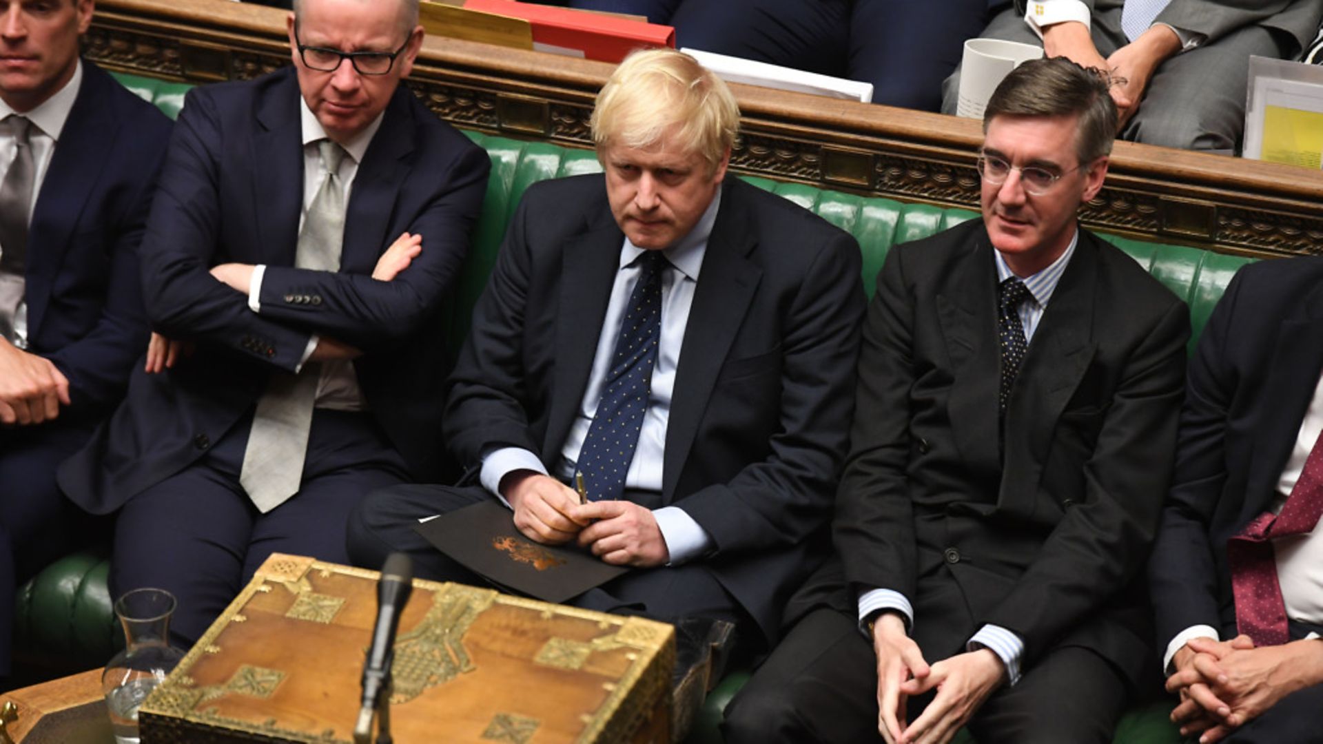 Boris Johnson (centre) in the House of Commons with Michael Gove and Jacob Rees-Mogg - Credit: PA