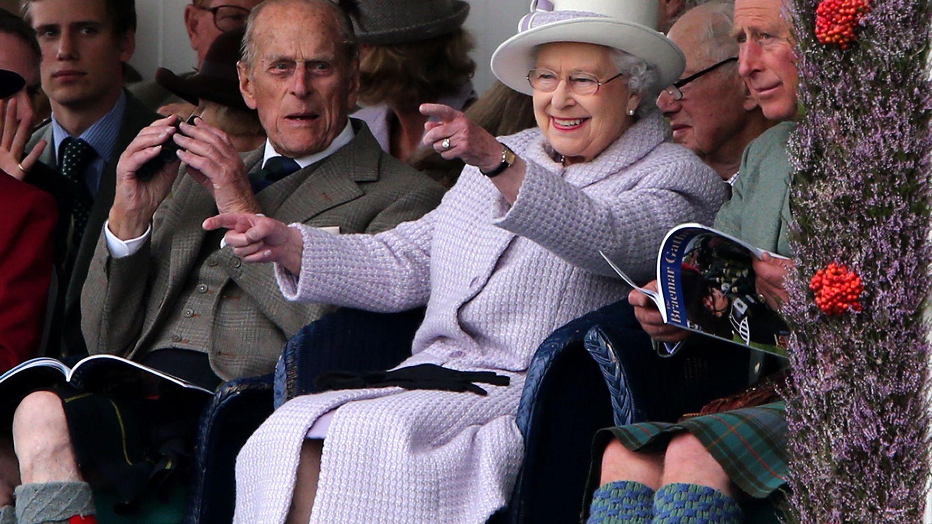 The Duke of Edinburgh and Queen Elizabeth II talking to the Prince of Wales (right) at the Braemar Gathering in the Princess Royal and Duke of Fife Memorial Park in Braemar - Credit: PA