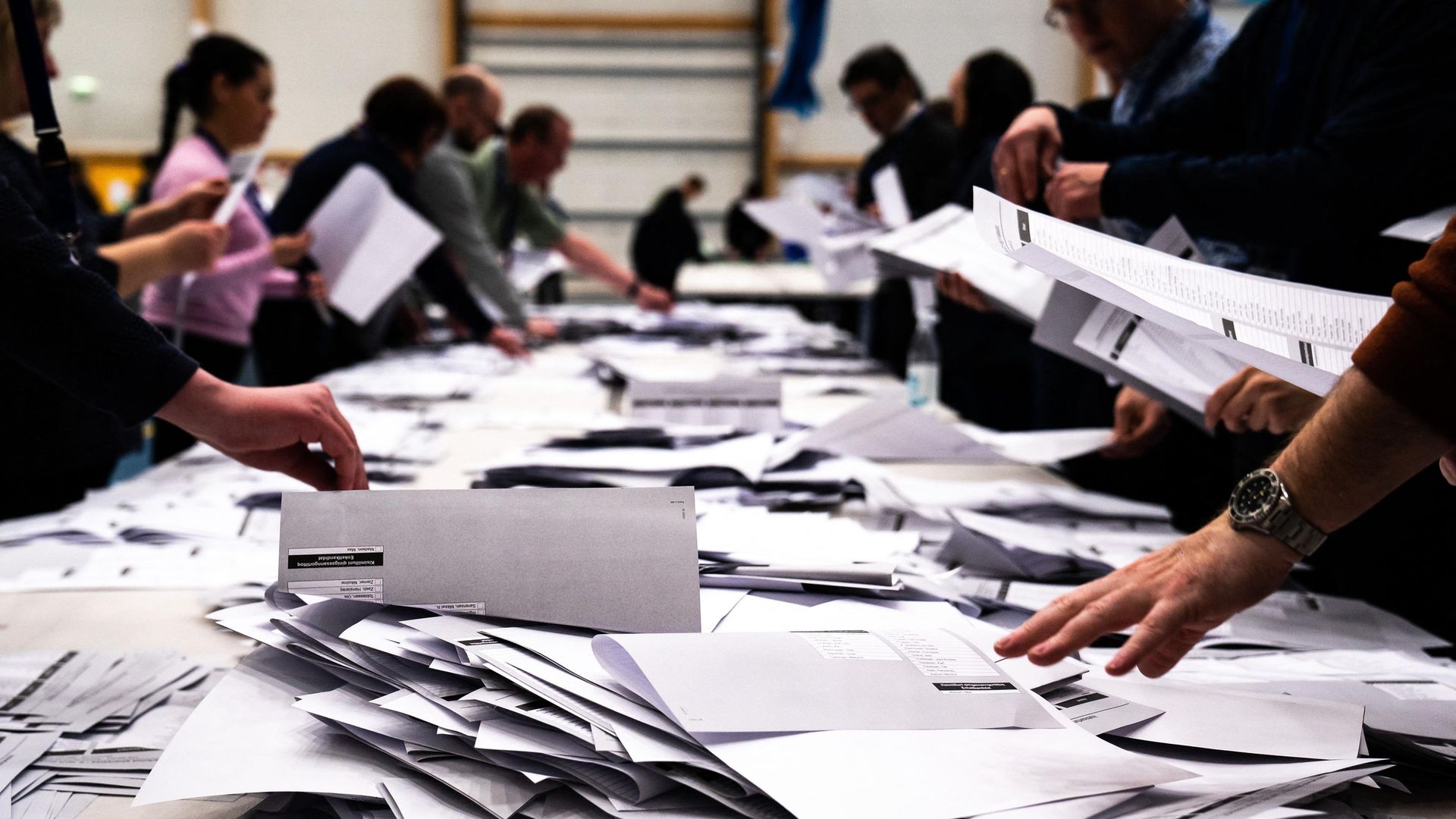 Electoral workers count ballots during elections in Nuuk, Greenland - Credit: Ritzau Scanpix/AFP via Getty Images