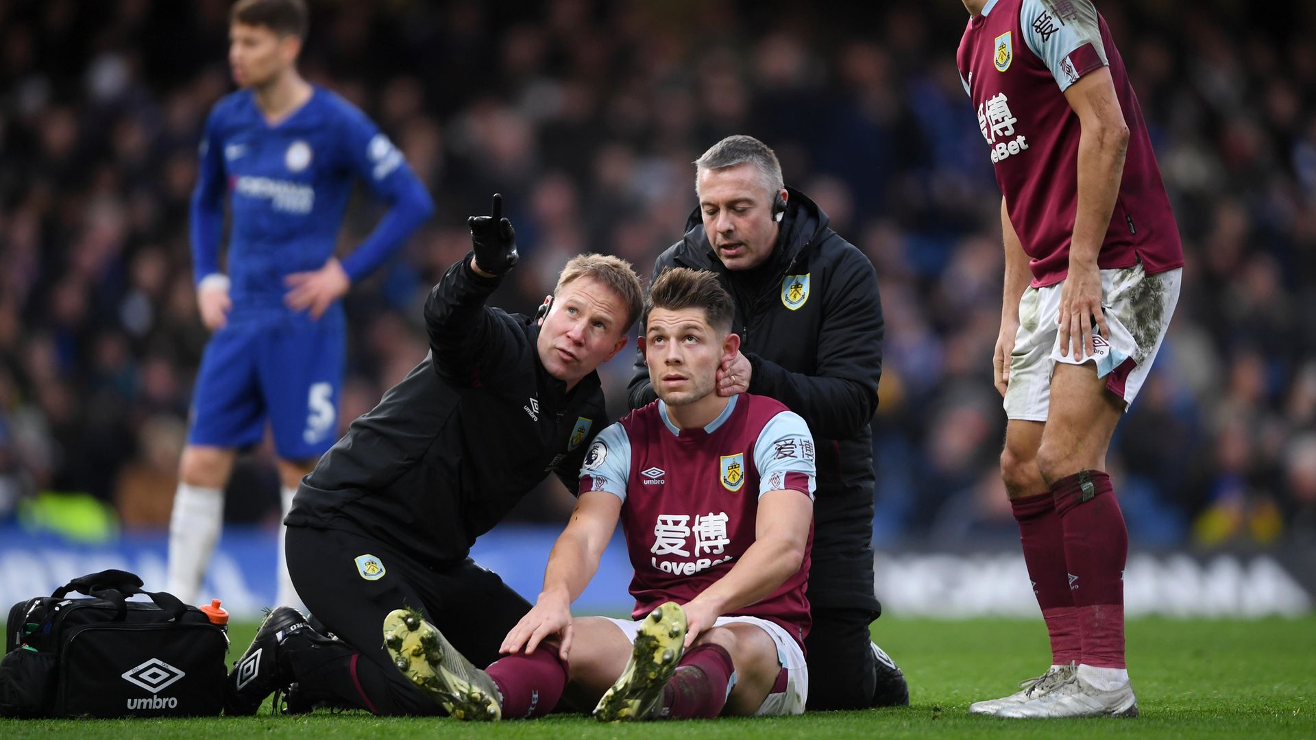 James Tarkowski of Burnley is assessed for concussion during a Premier League match between Chelsea and Burnley in January 2020 - Credit: Photo by Mike Hewitt/Getty Images