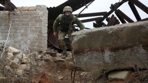 A Ukrainian serviceman patrols on the frontline with Russia-backed separatists near the city of Marinka, Donetsk region. Photo: AFP via Getty Images