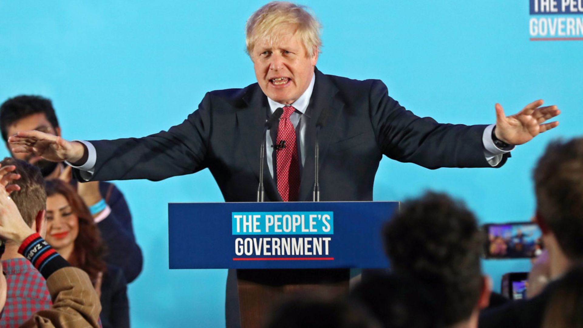 Boris Johnson at a rally with party supporters after the Conservative Party was returned to power in the General Election with an increased majority - Credit: PA