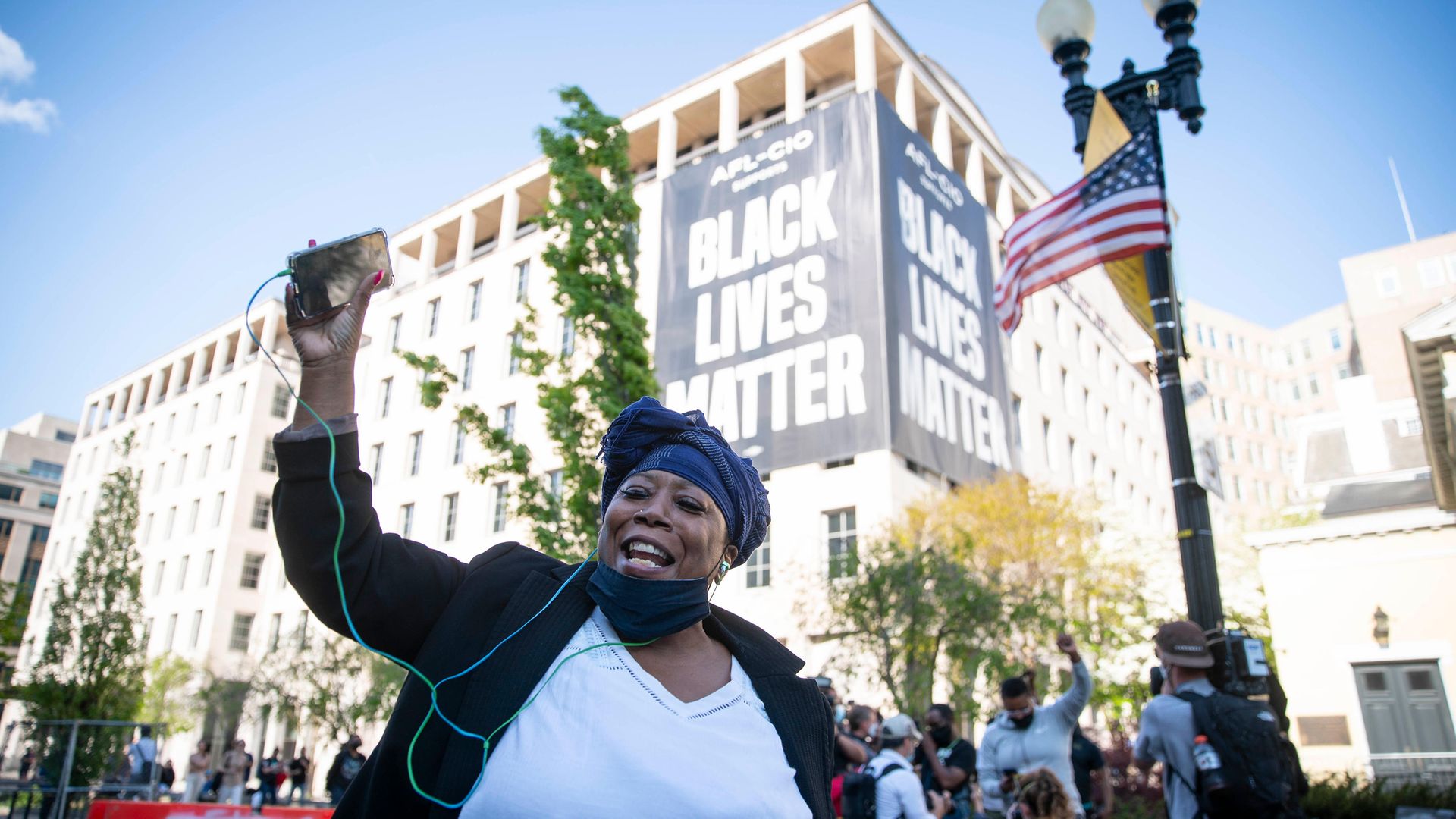 A person celebrates the verdict of the Derek Chauvin trial at Black Lives Matter Plaza near the White House - Credit: Getty Images