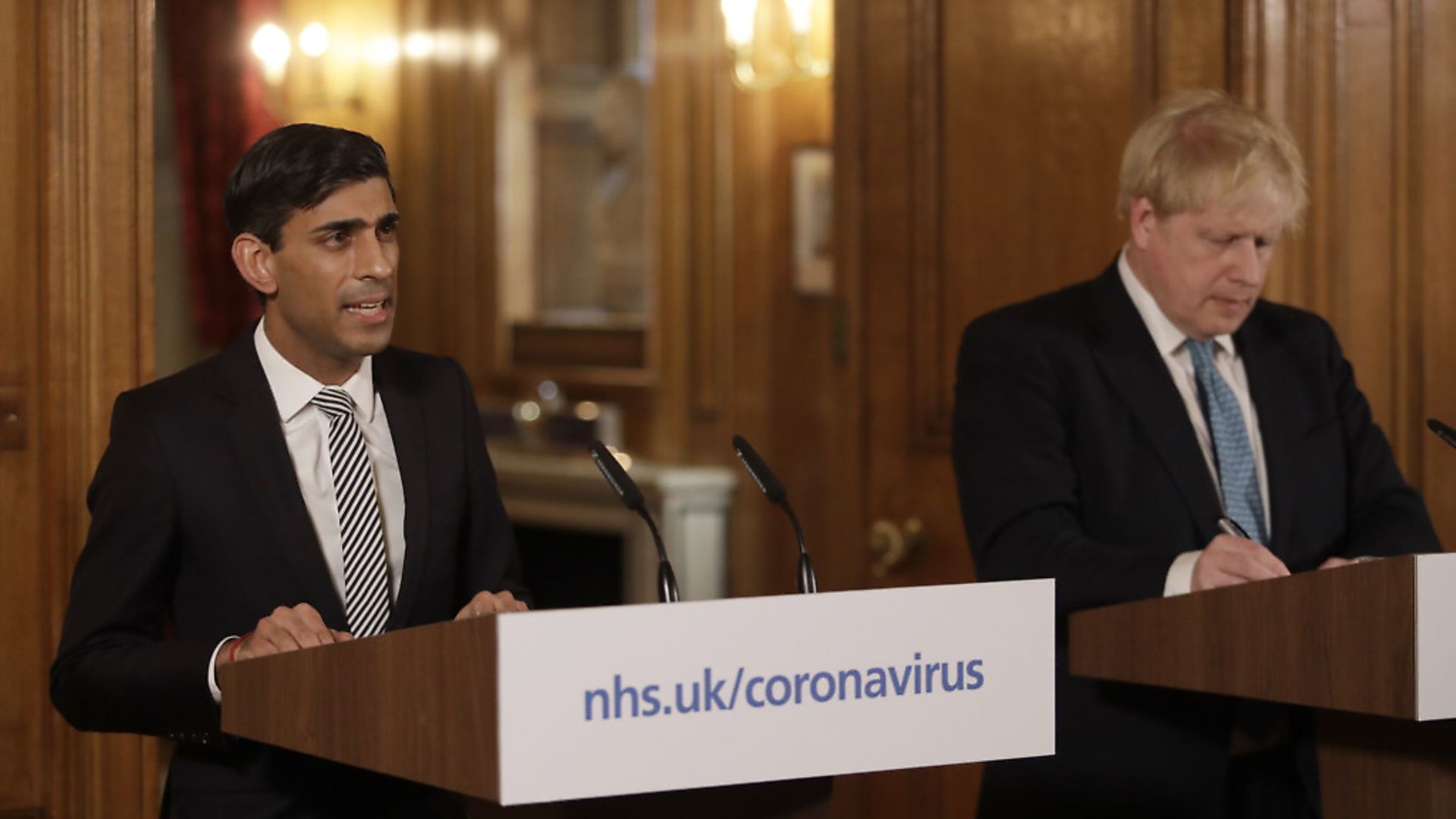 Chancellor Rishi Sunak with Prime Minister Boris Johnson at a media briefing in Downing Street, London, on Coronavirus (COVID-19). Photograph: Matt Dunham/PA Wire. - Credit: PA