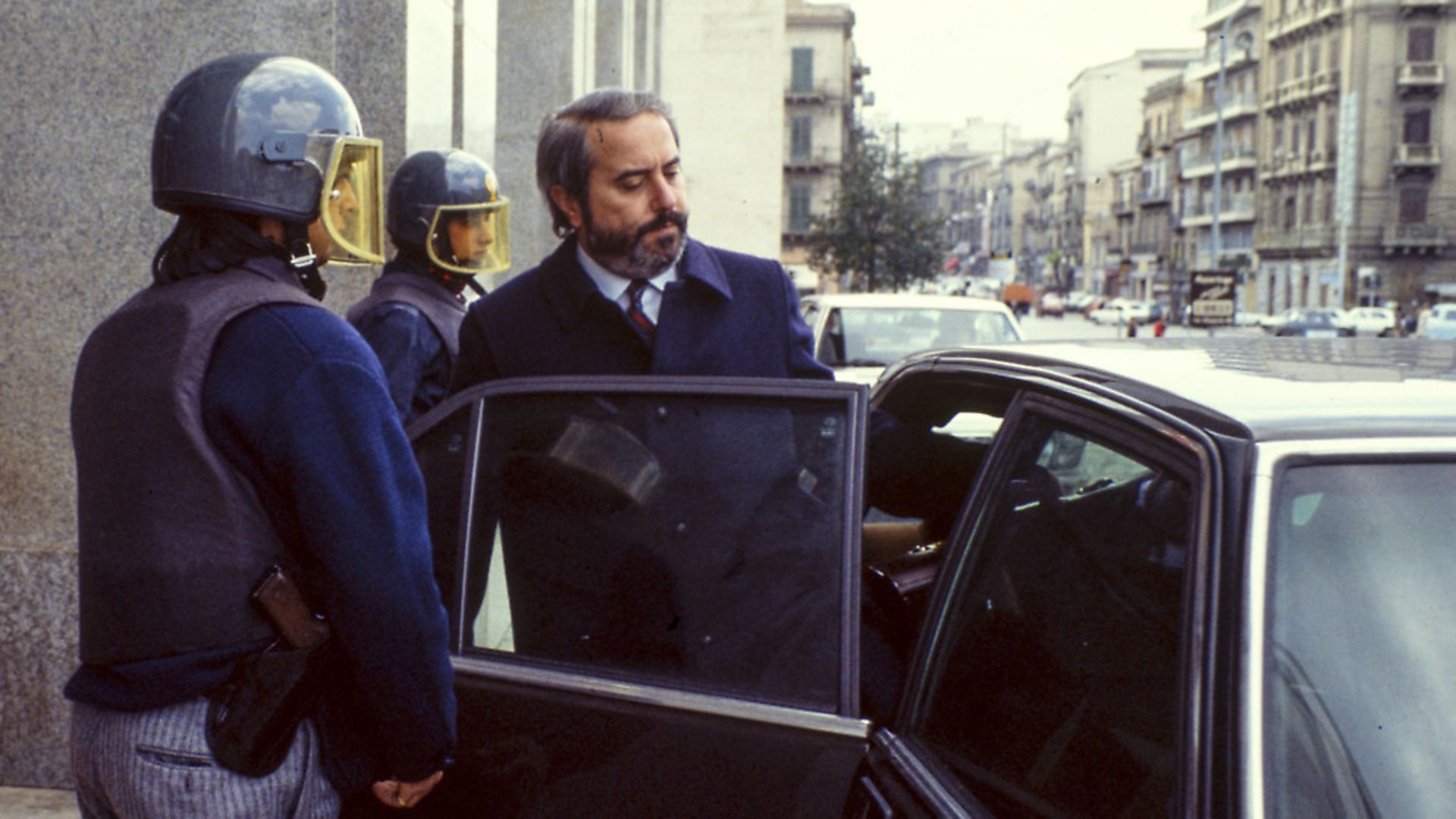 The Italian judge Giovanni Falcone is escorted by police out of the Court of Palermo, Italy, on May 16, 1985. Giovanni Falcone was killed by the Mafia in 1992. Photo: Vittoriano Rastelli/Corbis via Getty Images - Credit: Getty Images