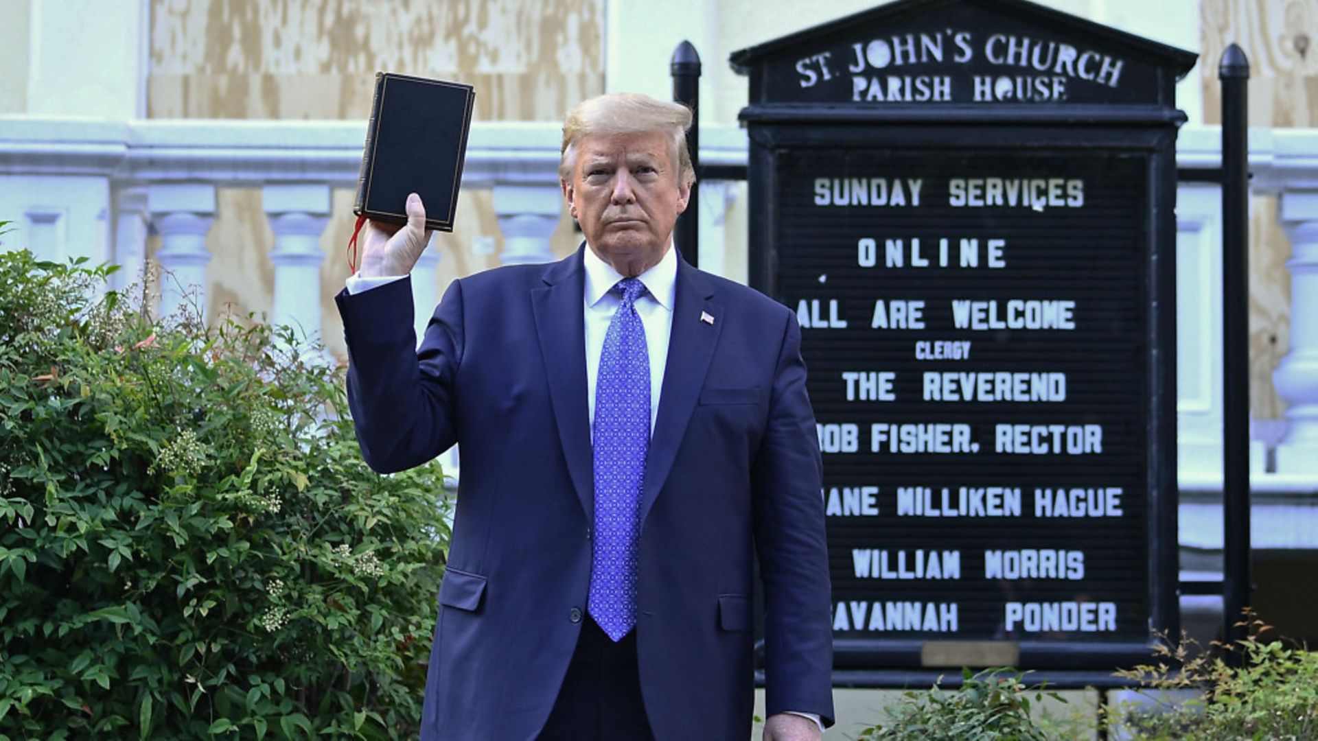 US President Donald Trump holds up a bible outside a Washington church - Credit: AFP via Getty Images