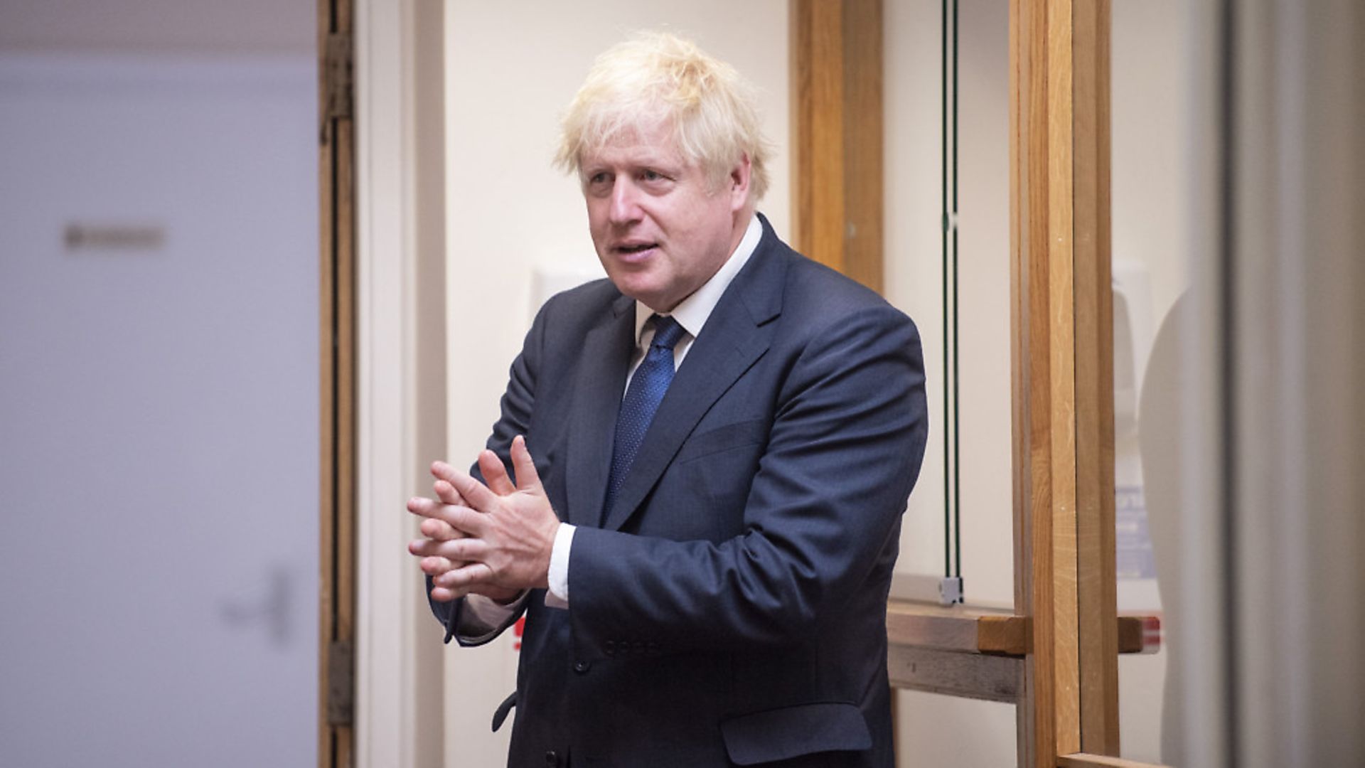 Prime Minister Boris Johnson sanitises his hands. Photograph: Lucy Young/Evening Standard/PA Wire - Credit: PA