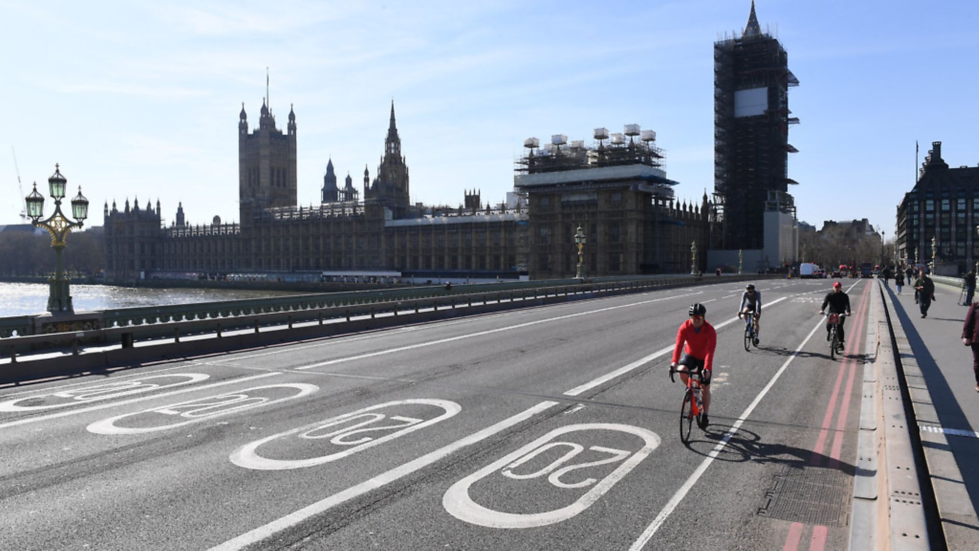 Cyclists riding across an empty Westminster Bridge in London, the day after Prime Minister Boris Johnson put the UK in lockdown to help curb the spread of the coronavirus. Picture: Stefan Rousseau/PA
