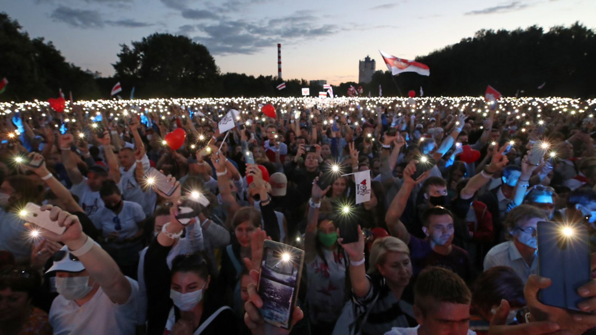 People use their mobile phone torches during a rally supporting Svetlana Tikhanovskaya, candidate for the presidential elections in Belarus (question seven) Nataliya Fedosenko/TASS (Photo by Nataliya FedosenkoTASS via Getty Images) - Credit: Nataliya Fedosenko/TASS