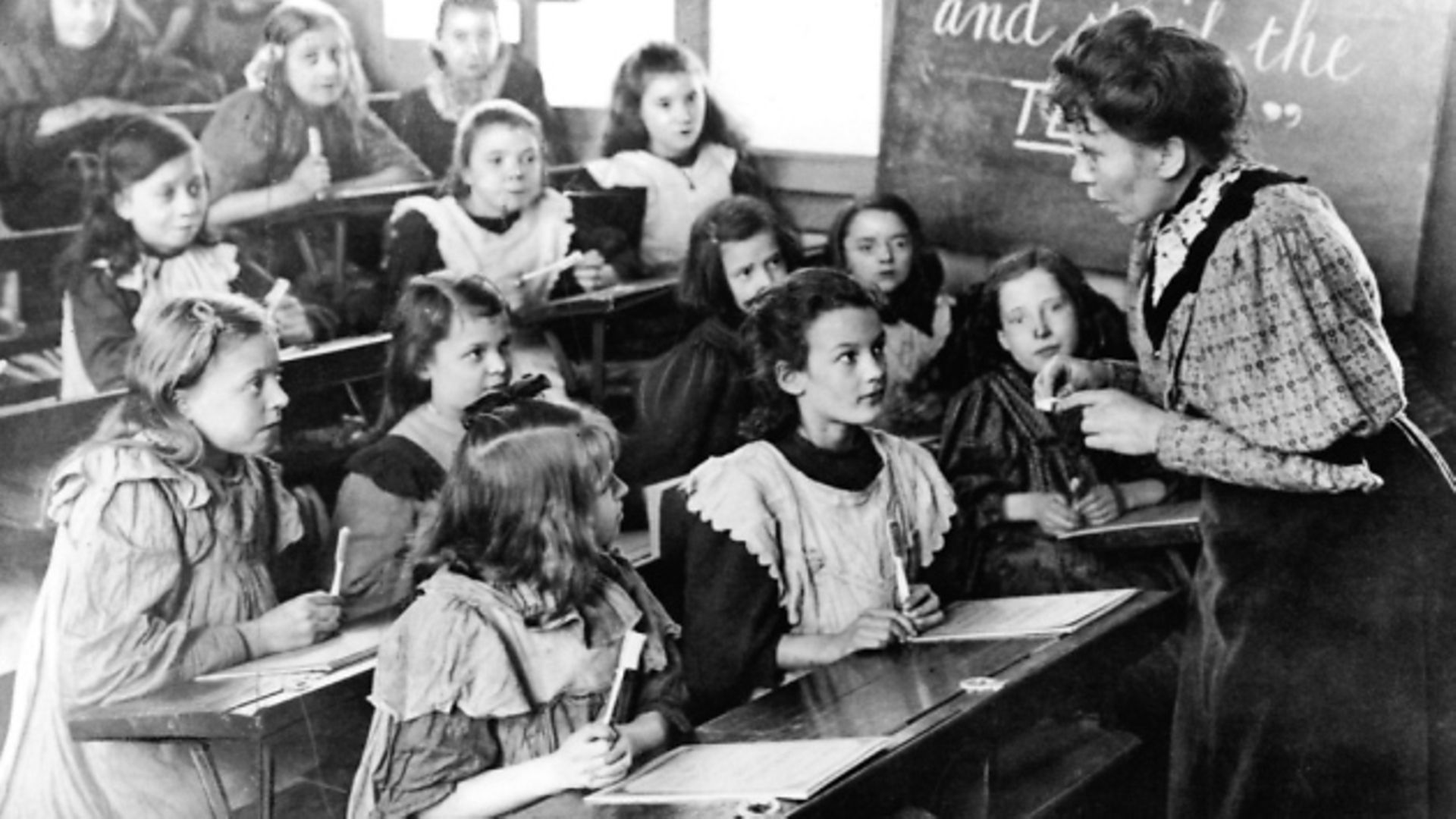 Teacher speaking to classroom of young girls. (Photo by Time Life Pictures/Mansell/The LIFE Picture Collection via Getty Images) - Credit: Time Life Pictures/Mansell/The LIFE Picture Collection via Getty Images