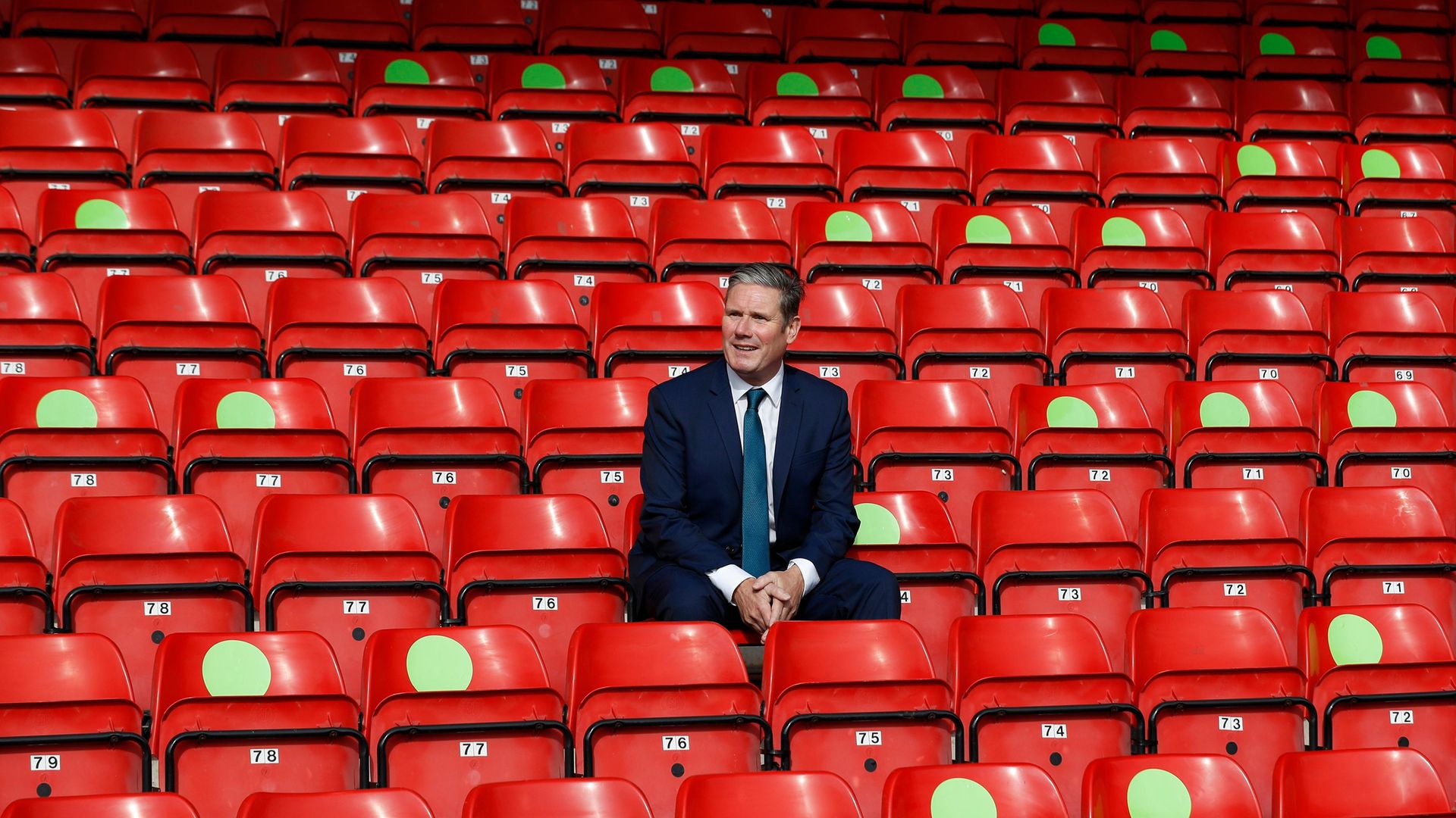 Labour Leader Keir Starmer sits in social distanced seating during a visit of Walsall Football Club - Credit: Getty Images