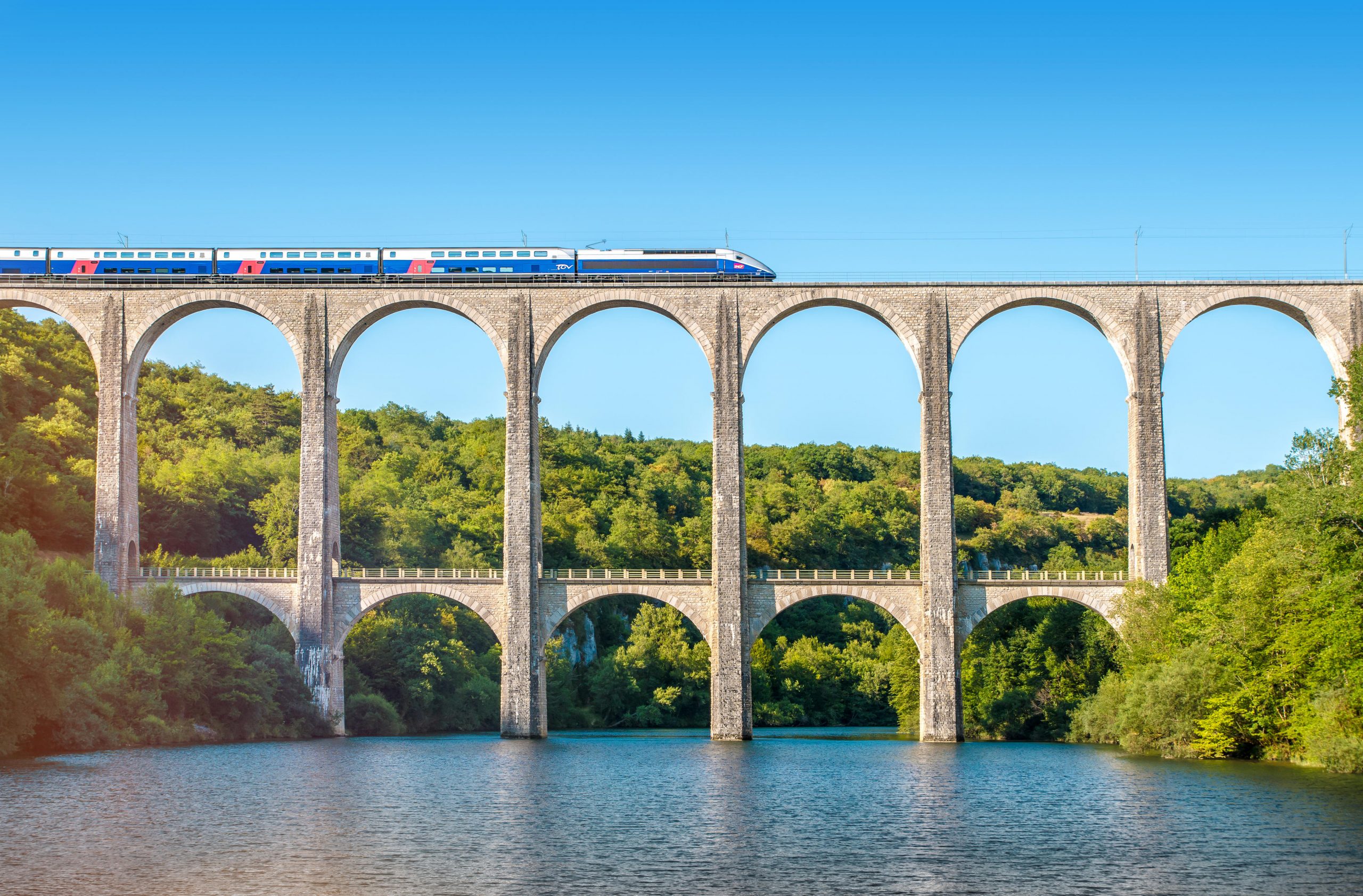 An SNCF train crosses the Cize-Bolozon viaduct bridge in Ain, Rhone-Alpes, France