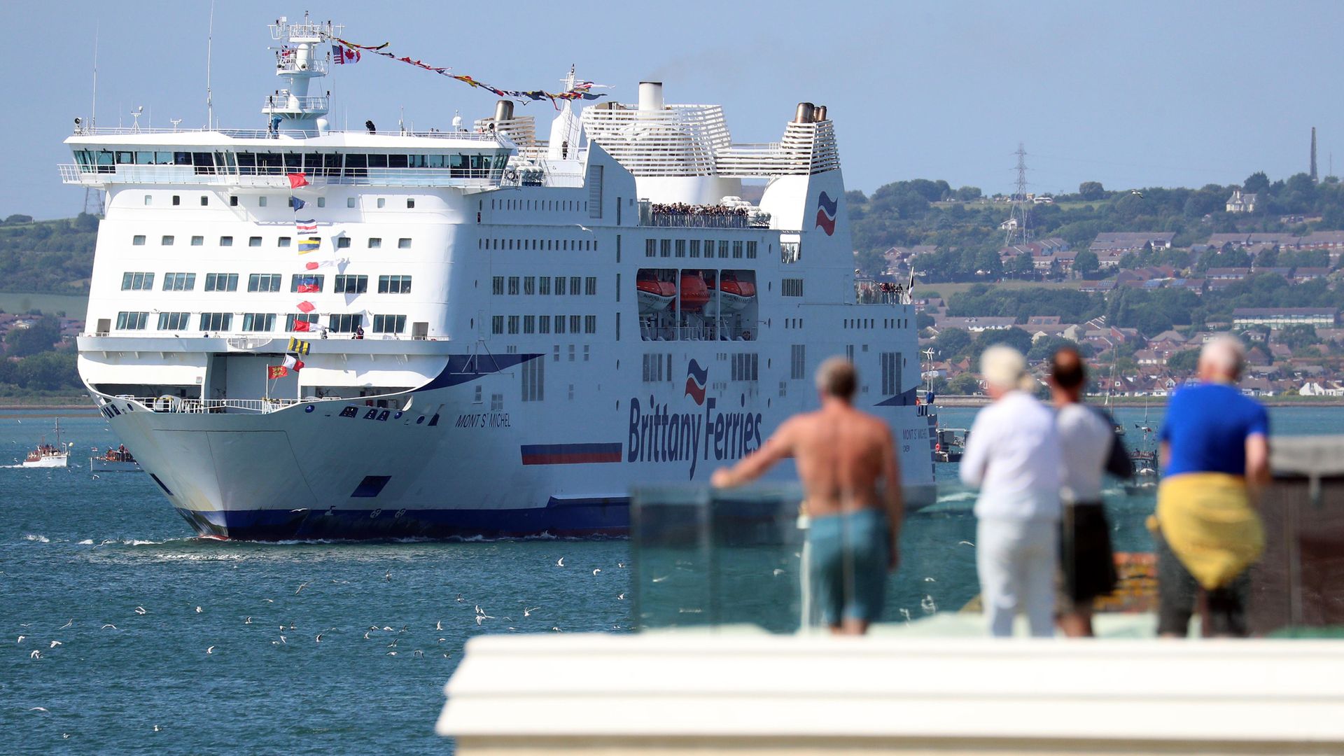 Brittany Ferries' MV Mont Saint Michel leaves Portsmouth harbour escorted by a flotilla of ships from the Royal Navy and Dunkirk small boats association, as it takes D-Day veterans to France, organised by the charity D-Day Revisited. - Credit: PA