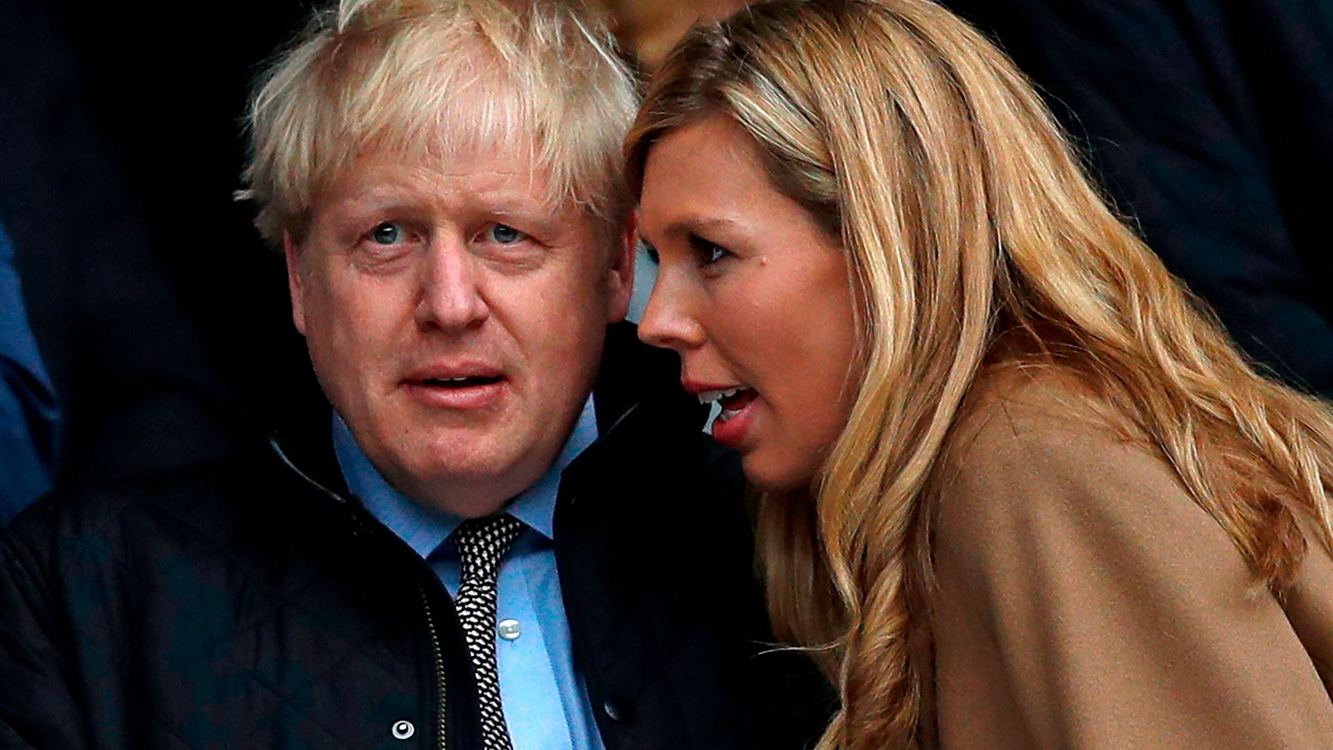 Boris Johnson with his partner Carrie Symonds (R) - Credit: AFP via Getty Images