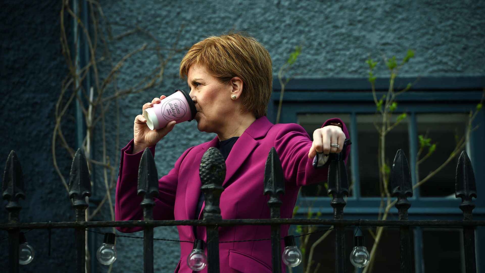 Scotland's First Minister Nicola Sturgeon, leader of the Scottish National Party (SNP), holds a hot drink while out campaigning for the Scottish Parliamentary election - Credit: PA