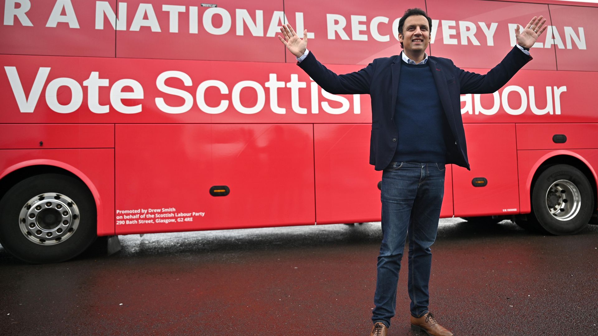 Scottish Labour leader Anas Sarwar poses in front of his party's election bus, in Glasgow - Credit: Getty Images