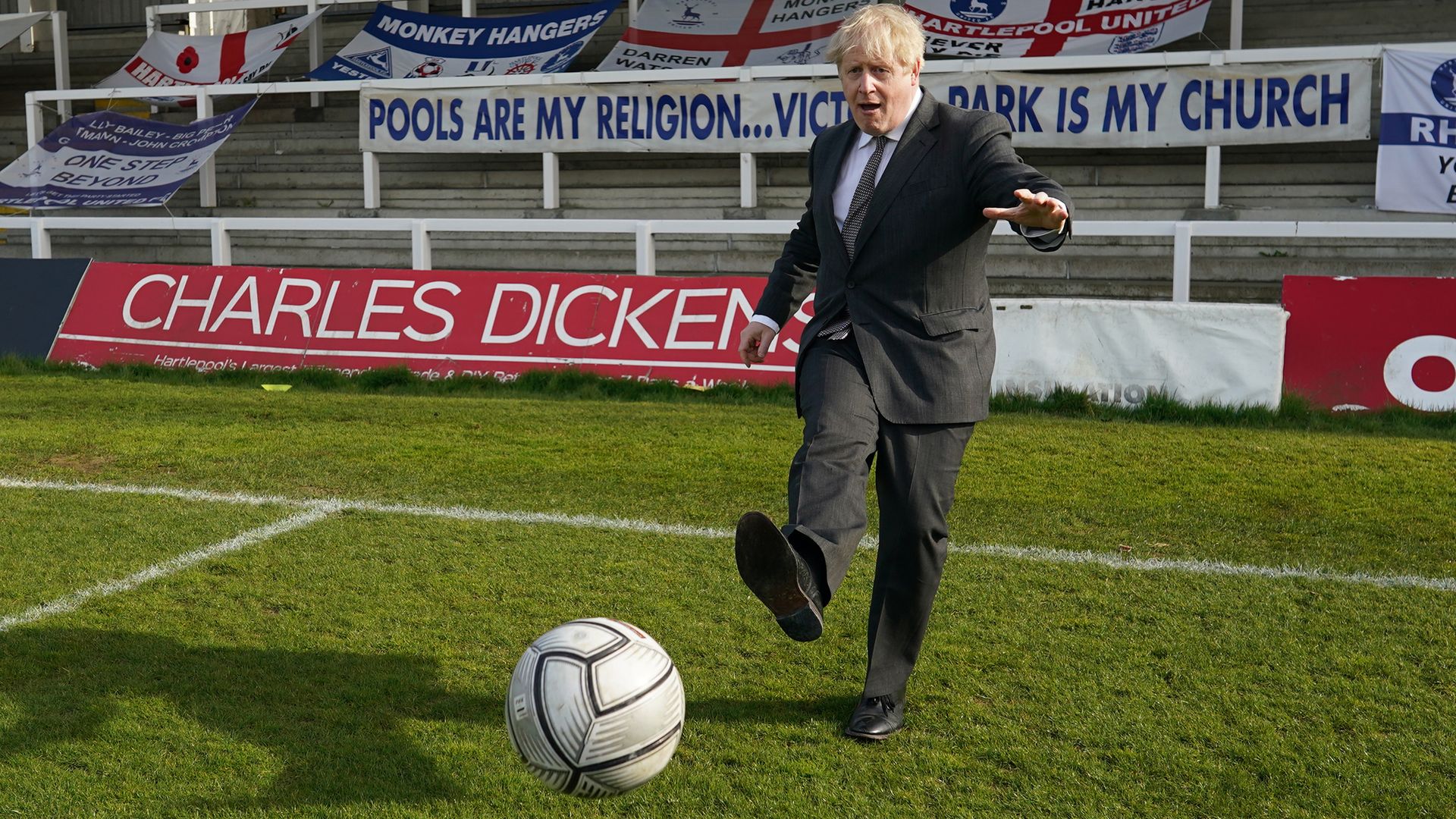 Prime Minister Boris Johnson kicks a football during a visit to the Hartlepool United Football Club - Credit: PA