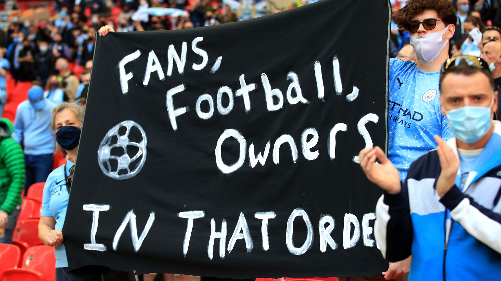 Manchester City fans at Wembley hold a banner protesting against the European Super League ahead of the Carabao Cup Final victory against Spurs - Credit: PA