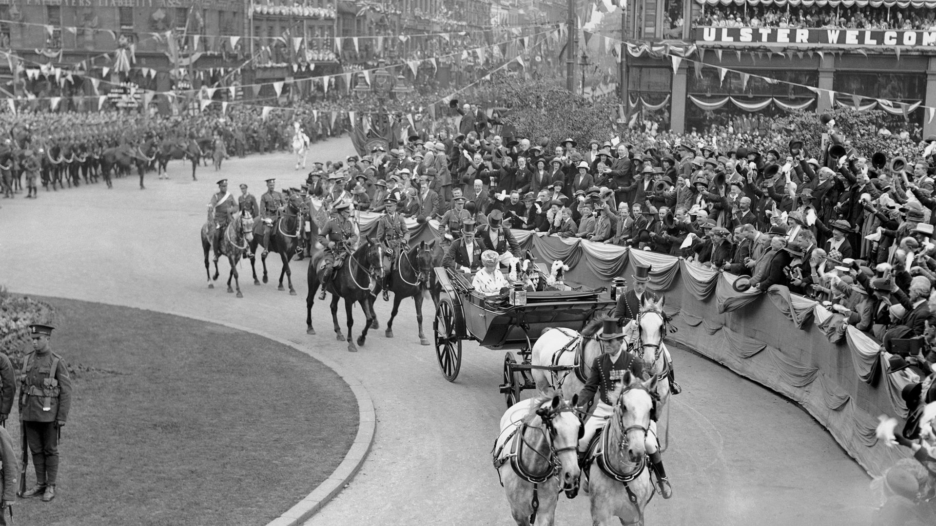 NI'S LONG AND WINDING ROAD: King George V and Queen Mary arrive for the opening of the parliament of Northern Ireland in Belfast, on June 23 1921 - Credit: Mirrorpix via Getty Images