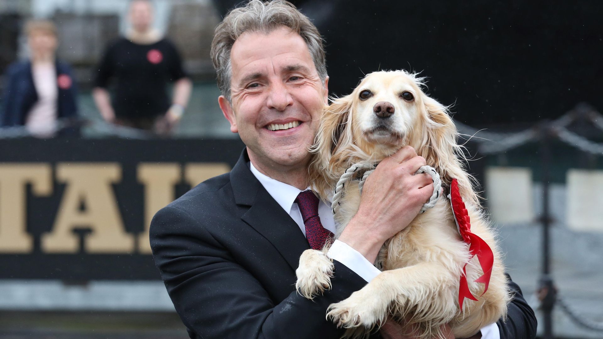 Labour's Dan Norris celebrating with his dog Angel after being elected West of England mayor - Credit: PA