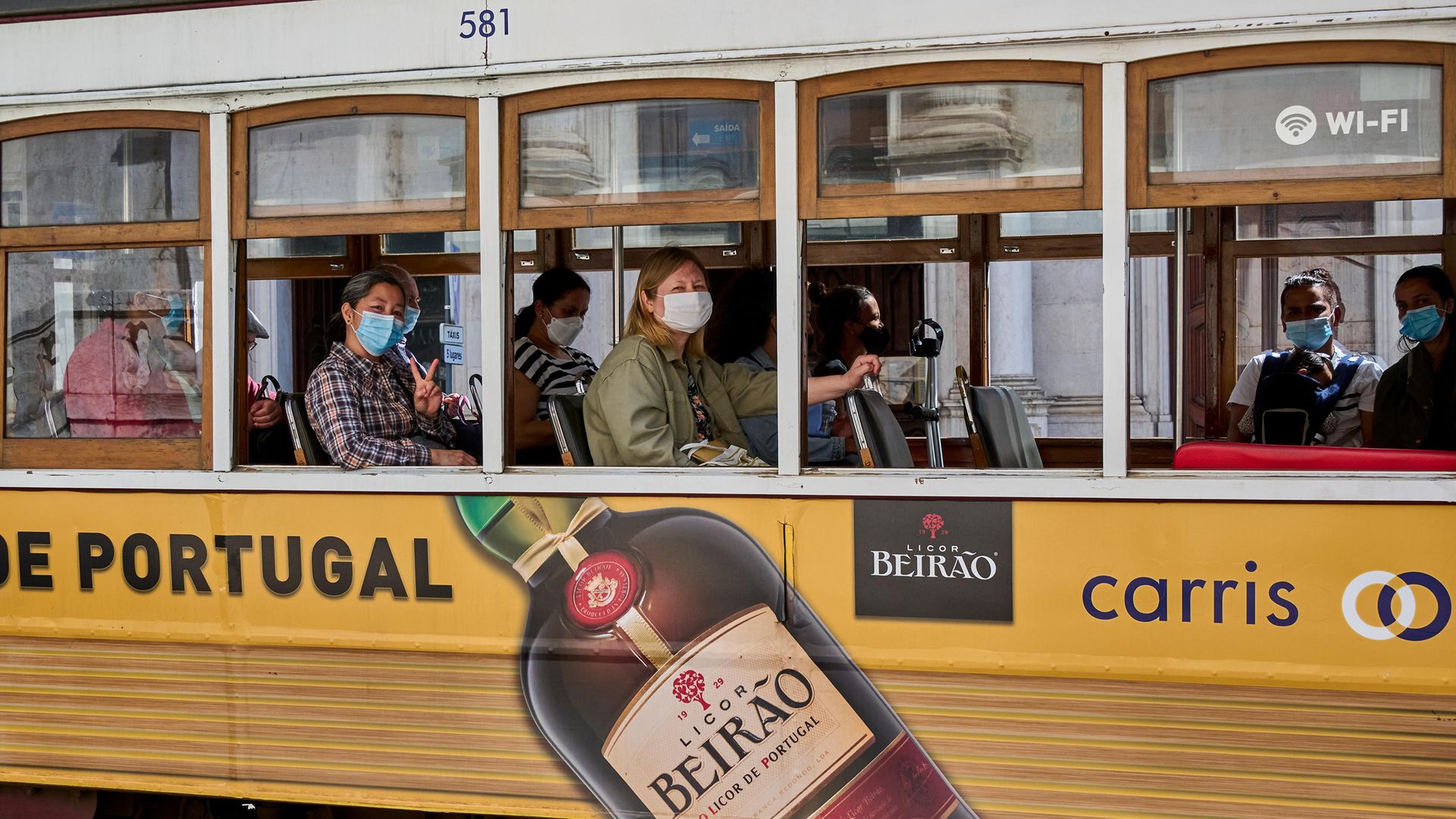 Mask-clad passengers ride a tram during the COVID-19 Coronavirus pandemic in Lisbon, April 2021

Photo by Horacio Villalobos/Corbis via Getty Images - Credit: Photo by Horacio Villalobos/Corbis via Getty Images