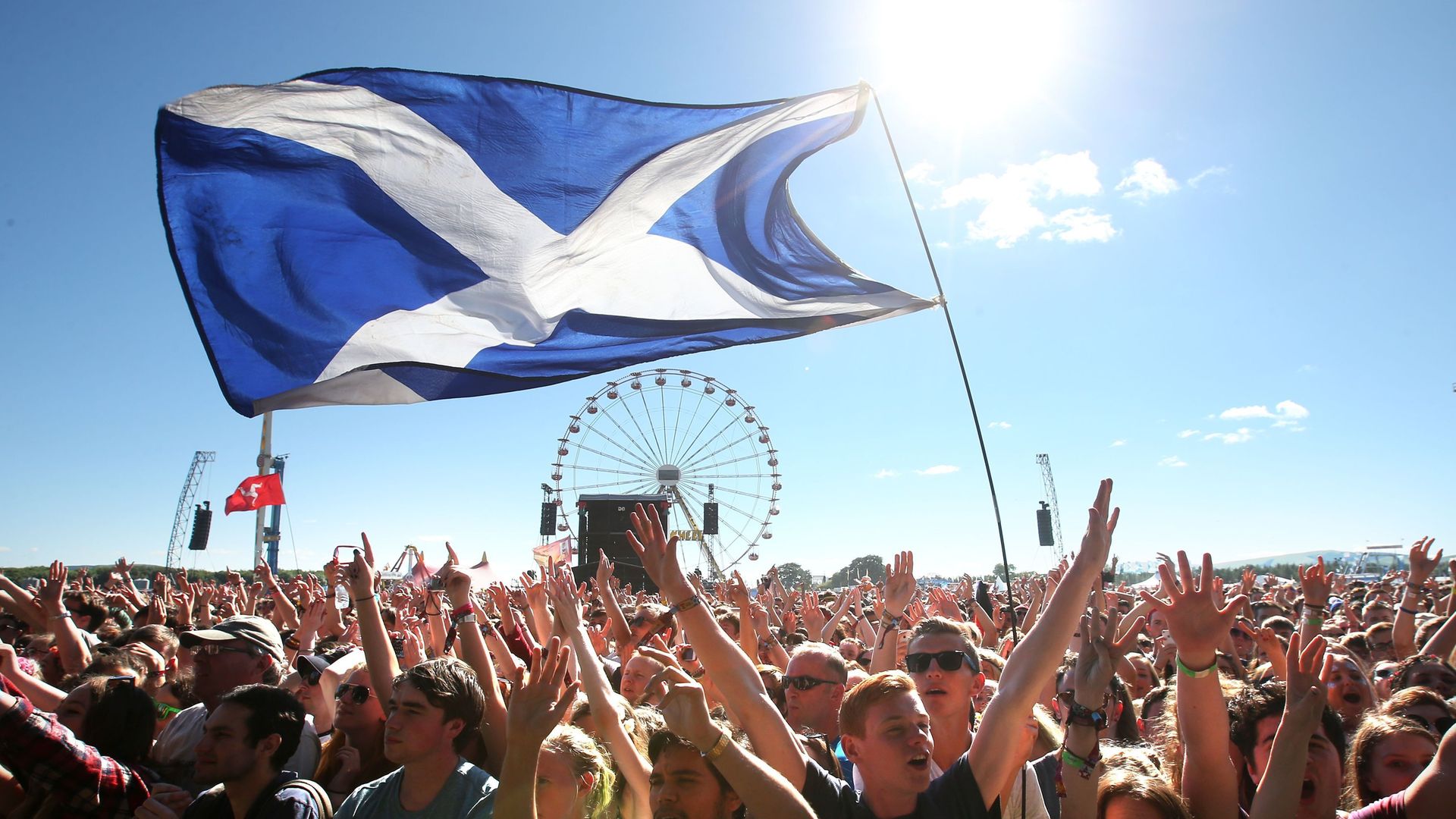 Music fans with a Saltire Flag in Kinross, Scotland - Credit: PA