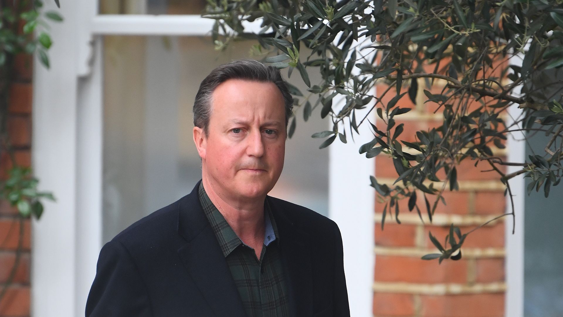 David Cameron outside his London home - Credit: PA