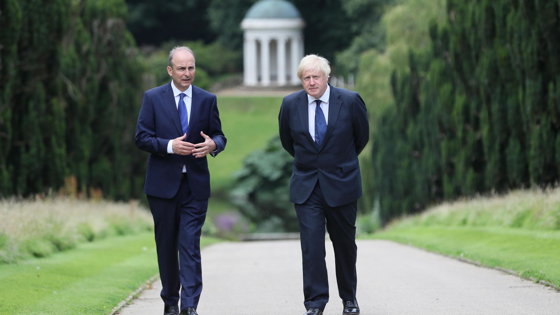 Prime minister Boris Johnson (right) and Irish taoiseach Micheal Martin walking in the gardens of Hillsborough Castle during a visit the prime minister's made to Belfast. - Credit: PA