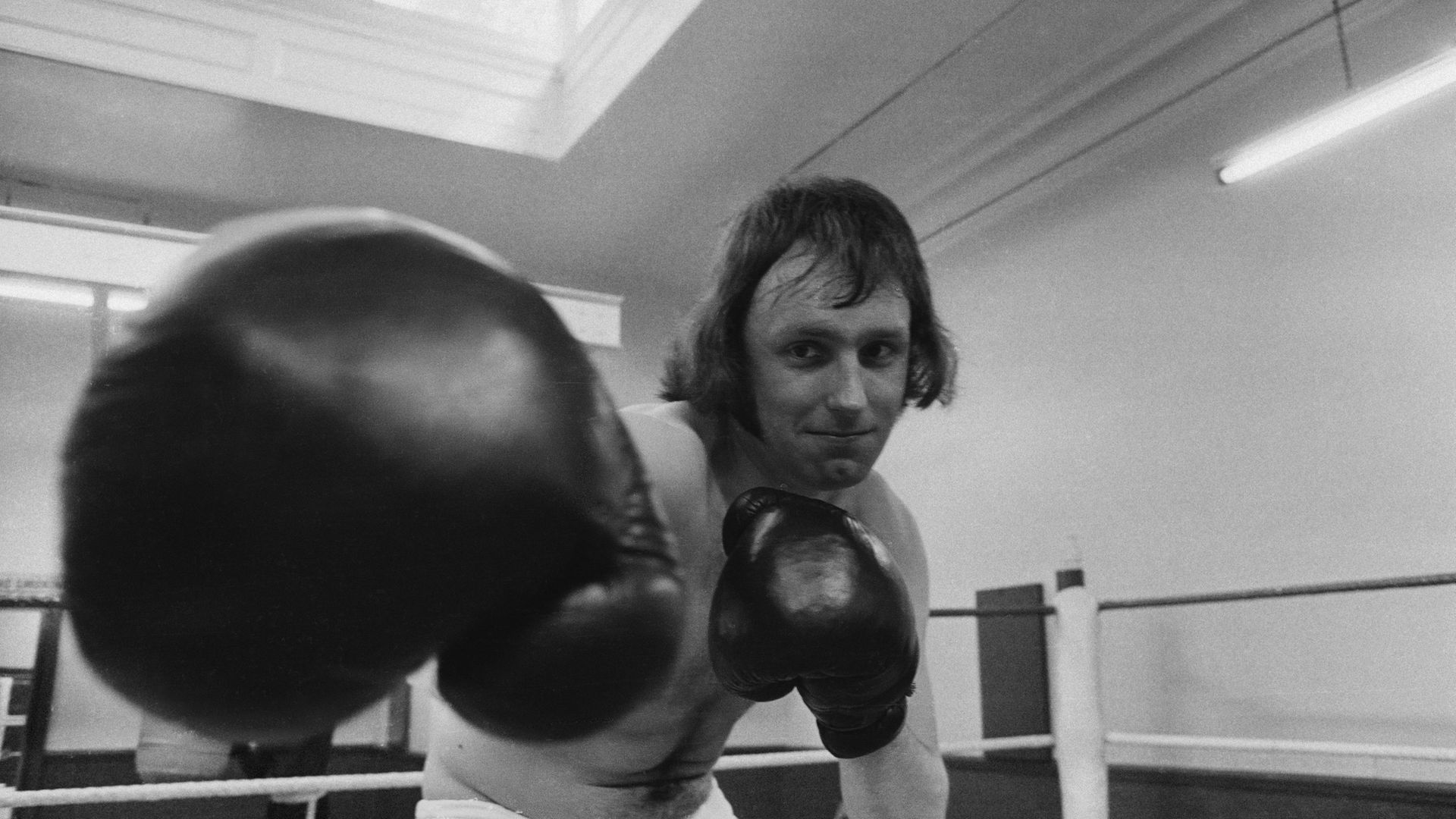 Paul Dacre, then reporter for the Daily Express, training in the boxing ring at a gym in 1972 - Credit: Getty Images