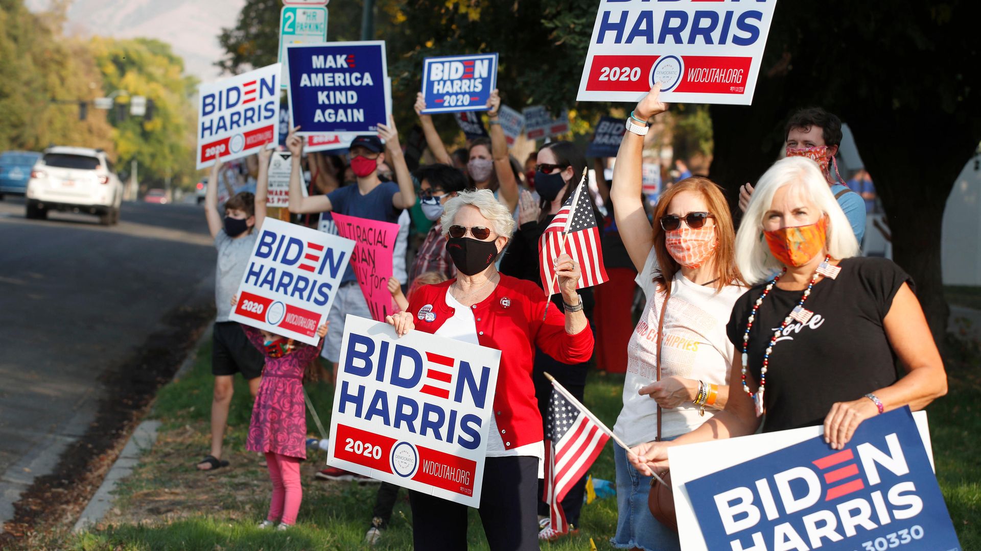 Women in Utah show their support for Joe Biden during the US election campaign; America’s women are strongly Democratic and have been vital to the party's electoral success - Credit: AFP via Getty Images