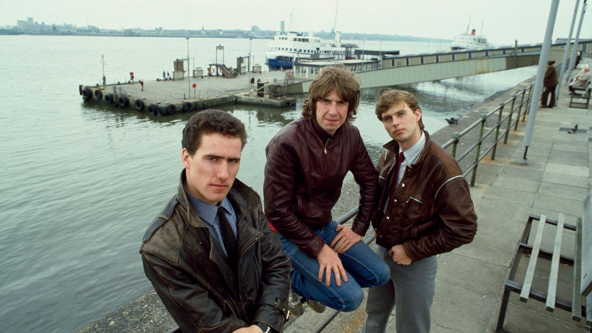 From left, Andy McCluskey, Malcolm Holmes and Paul Humphreys of Orchestral Manoeuvres in the Dark on Liverpool's waterfront in 1982 - Credit: Getty Images