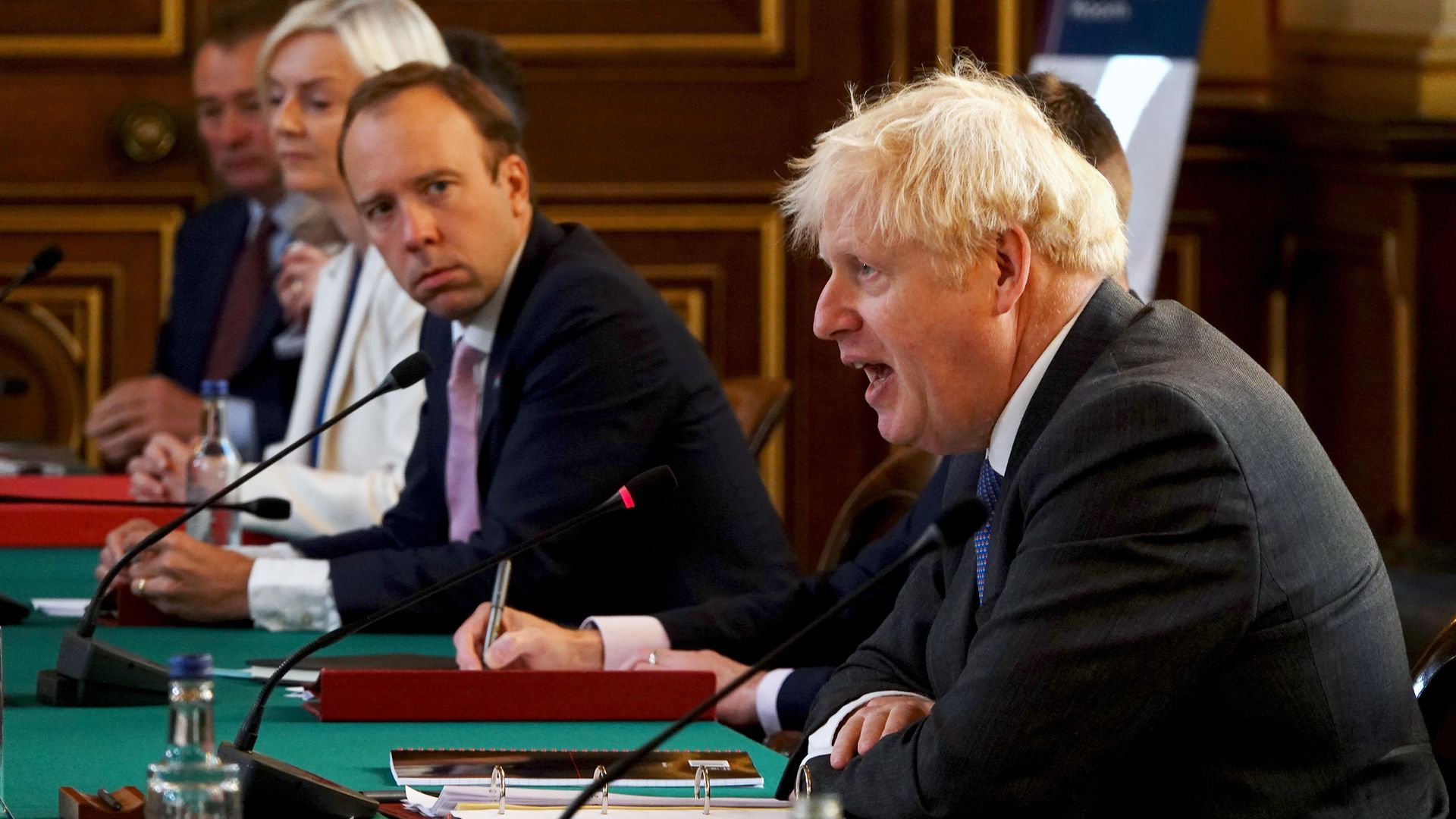 Health secretary Matt Hancock listens to Prime Minister Boris Johnson (right) during a cabinet meeting - Credit: PA