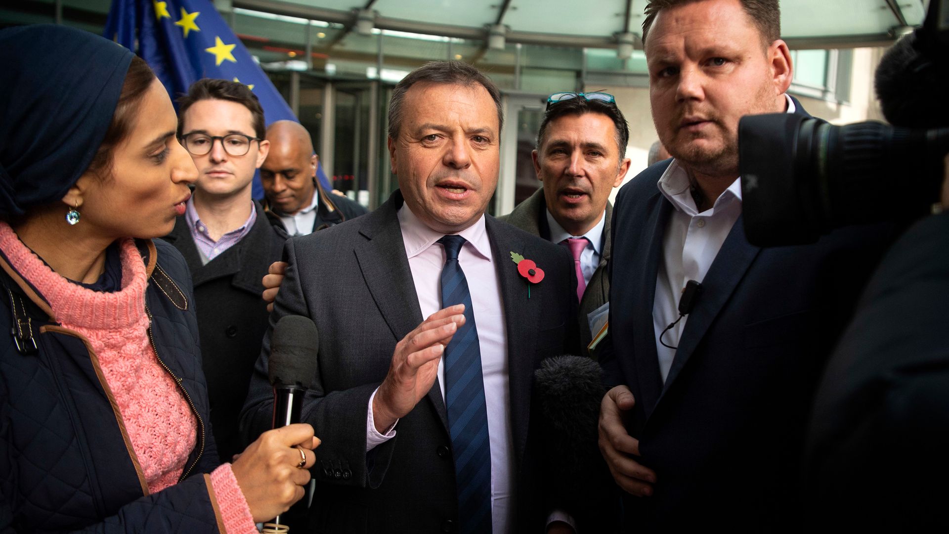 Leave campaigner Arron Banks (centre) claims he's being discriminated against for his political views - Credit: PA