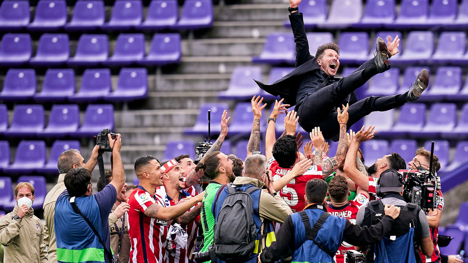 Atletico Madrid coach Diego Simeone is thrown by the air after winning the La Liga title - Credit: Photo by Pedro Salado/Quality Sport Images/Getty Images