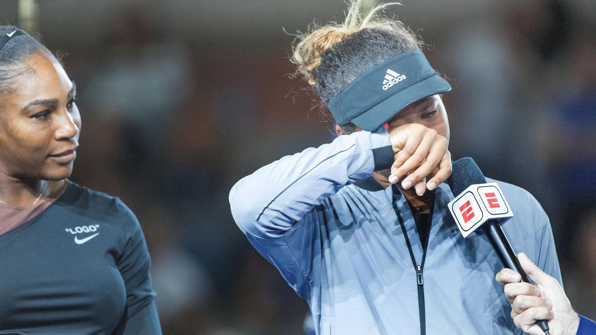 Naomi Osaka of Japan wipes away the tears after beating Serena Williams to win the 2018 US Open - Credit: Photo by Tim Clayton/Corbis via Getty Images