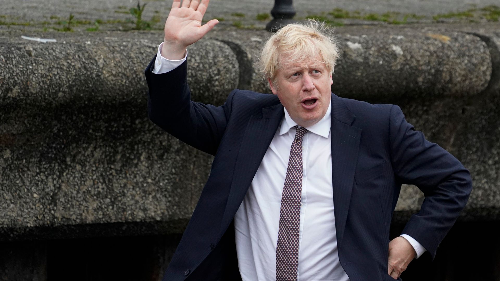 Boris Johnson waves to onlookers during a visit to Falmouth ahead of the G7 summit - Credit: Getty Images
