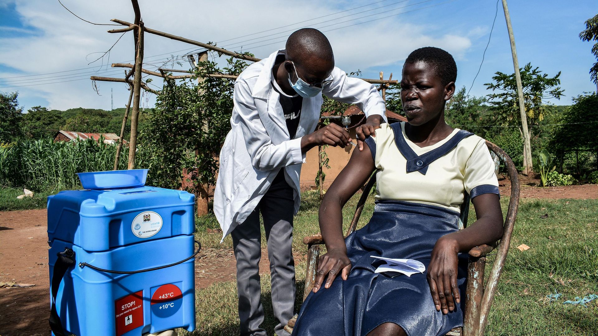 A health worker injects a woman with the Oxford/AstraZeneca Covid-19 vaccine during door-to-door visits in Siaya, Kenya - Credit: AFP via Getty Images