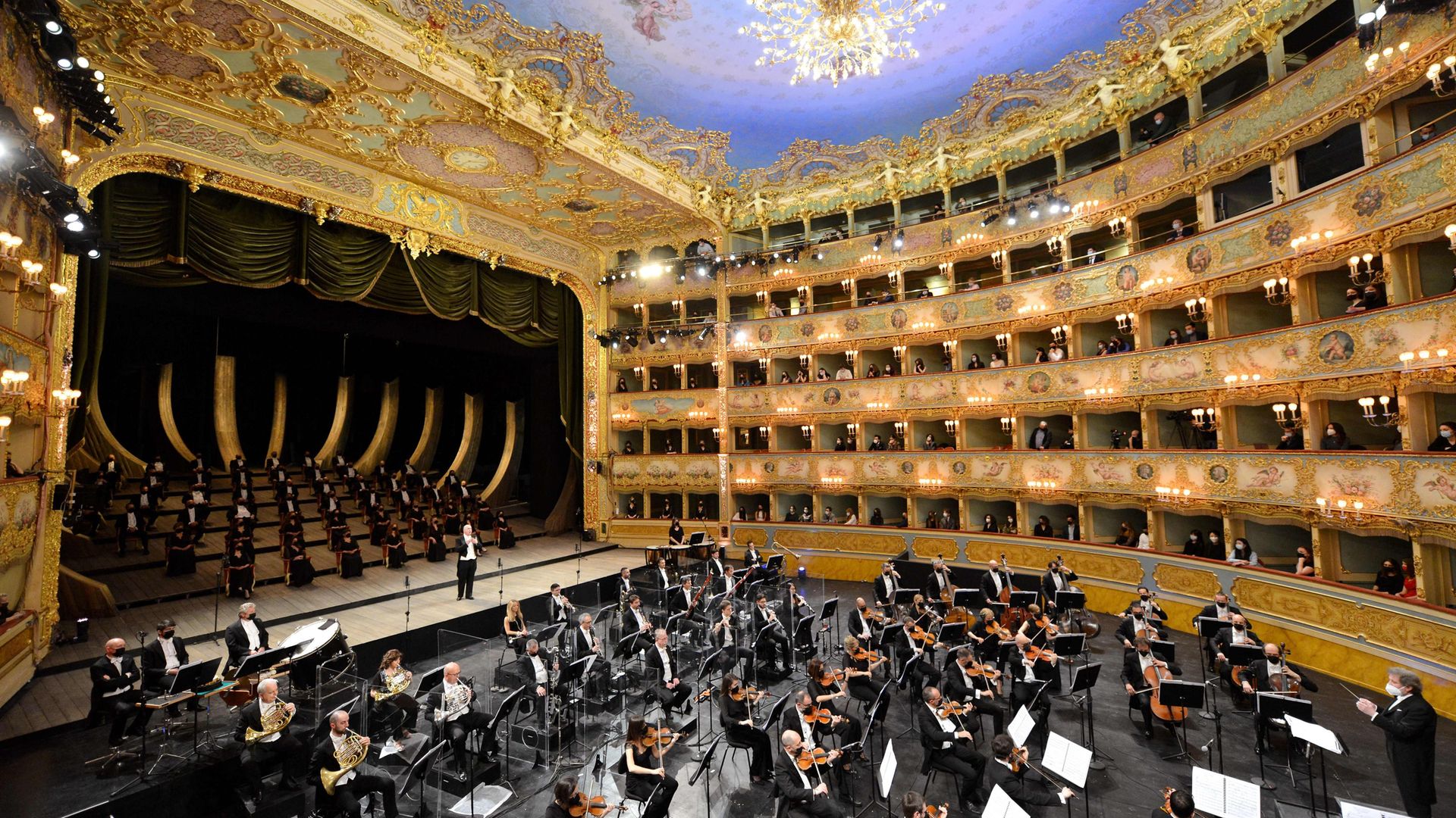 Musicians and chorus of La Fenice theatre perform the Verdi e la Fenice to mark its reopening after lockdown in April 2021 - Credit: AFP via Getty Images