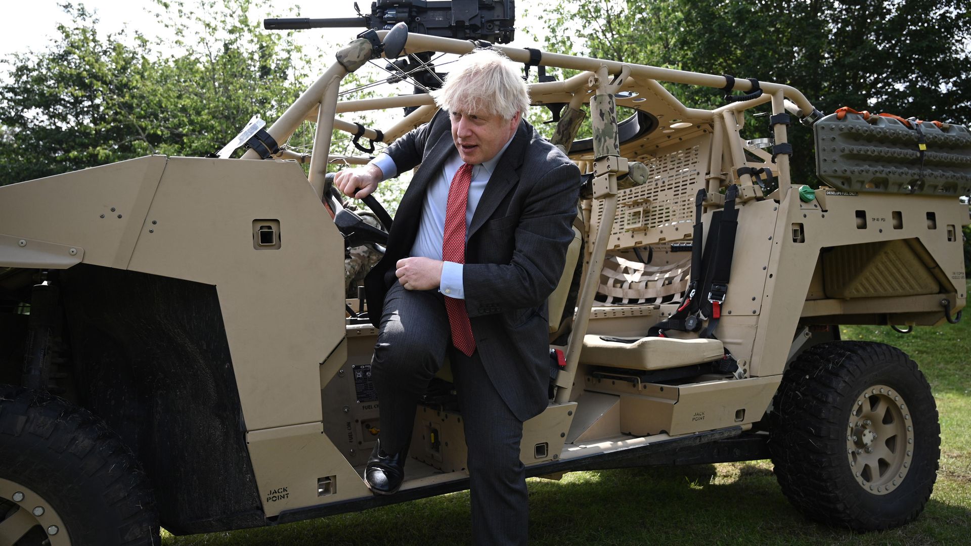 Boris Johnson steps down from an armoured vehicle during a trip to Aldershot garrison on June 24, 2021 - Credit: Getty Images