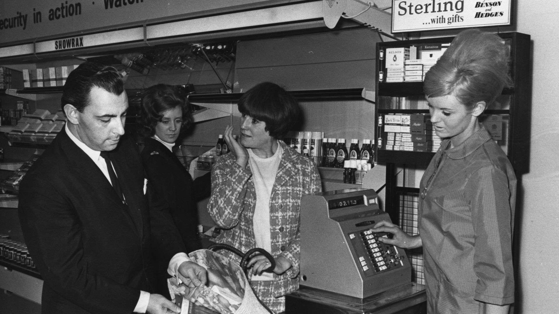 A store detective showing how a shop-lifter can use a false lining to hide stockings, during a demonstration at 'Shopshow International', Earl's Court, London - Credit: Photo by Keystone/Getty Images
