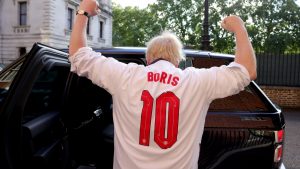 Boris Johnson, wearing an England top over his shirt, heads to Wembley for the semi-final against Denmark - Credit: Twitter