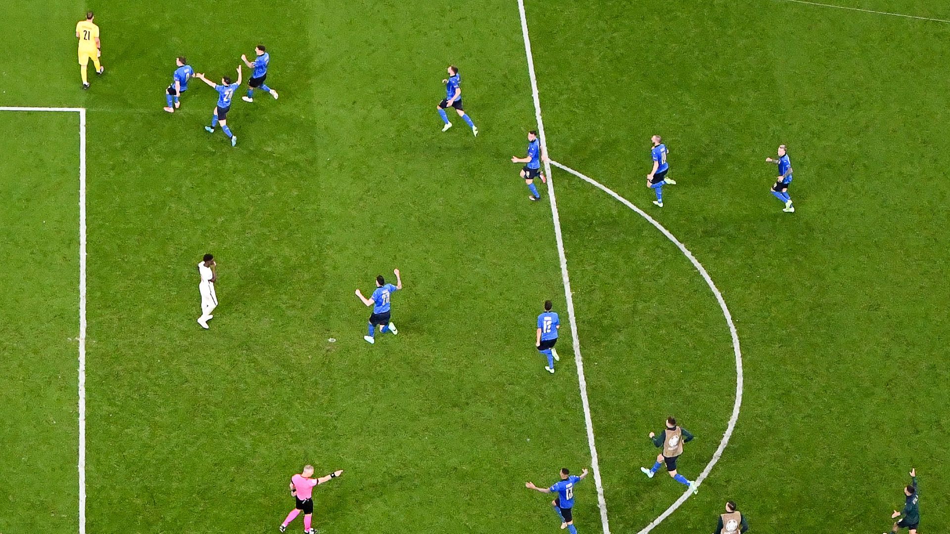 Italy players celebrate after England's midfielder Bukayo Saka fails to score past Italy's goalkeeper Gianluigi Donnarumma in the penalty shootout - Credit: Photo by Paul Ellis/AFP via Getty Images