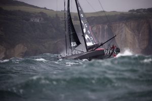 A yacht taking part in the Fastnet Race battles stormy seas near the start line off the Isle of Wight. 