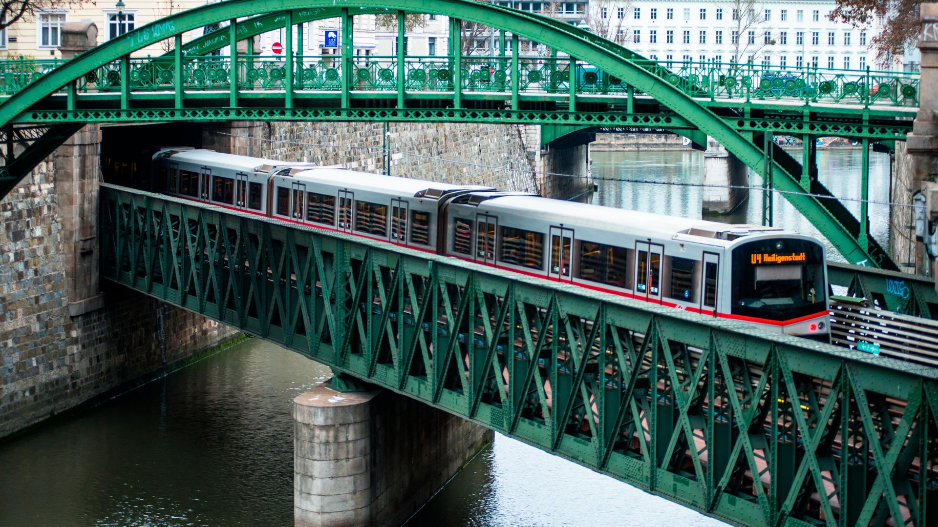 A U-Bahn train crosses Vienna's Zollamtsbrücke Truss Bridge while passing under the Zollamtssteg Arch Bridge. A change to a public transport term in Austria has prompted debate about language - Credit: Education Images/Universal Image