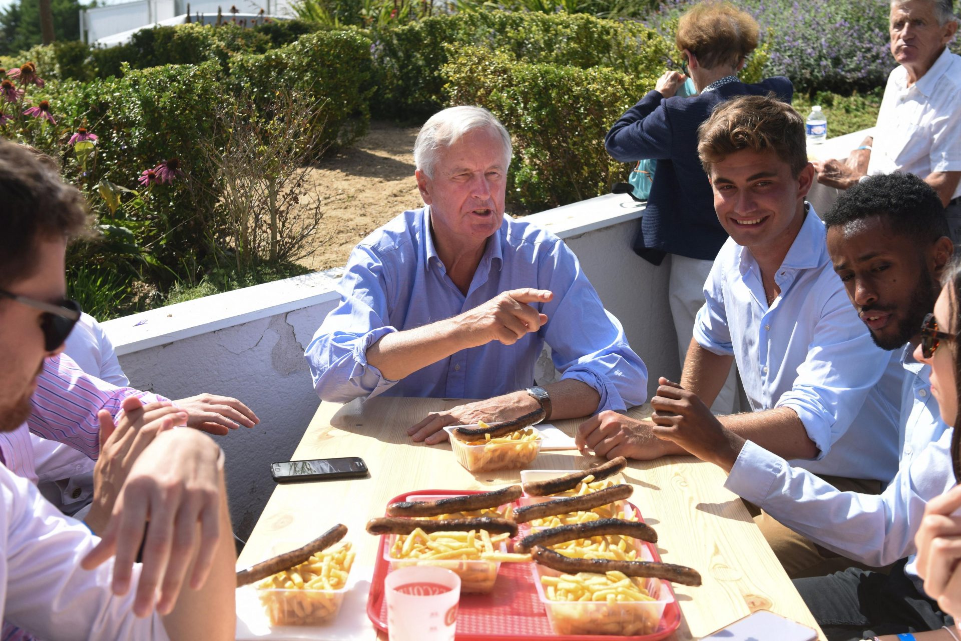 Michel Barnier sits with young delegates during the Les Republicains party's youth summit in La Baule, August 28. Photo: Sebastien Salom-Gomis/AFP via Getty Images