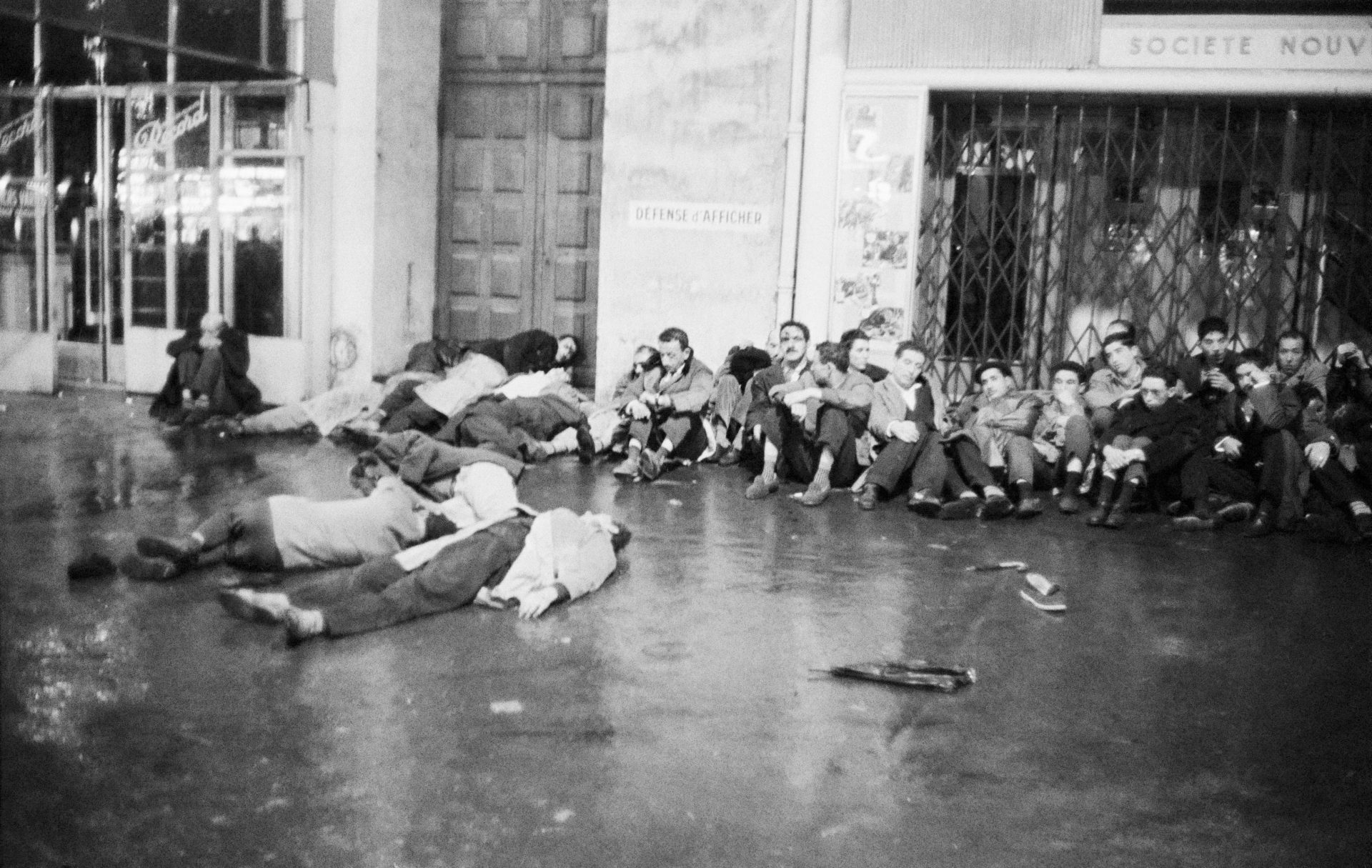 The bodies of demonstrators shot by police lie in front of other protestors detained by officers. Photo: Daniele Darolle/Sygma via Getty Images.