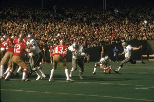 Toni Fritsch, on the far right, kicks
one of three sucessful field goals
for the Dallas Cowboys against the
San Francisco 49ers in a 1972 NFC
playoff game Candlestick Park, San
Francisco. The Cowboys defeated
the 49ers 30-28. Credit: James Flores/
Getty Images