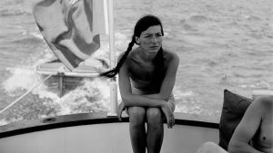 Juliette Gréco, seated in the stern of a boat off the coast of France, in 1950. Credit: REPORTERS ASSOCIES/Gamma- Rapho via Getty Images)